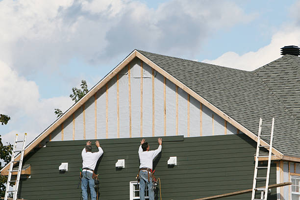 Professional Storm Damage Siding Repair technician working in Glen Easton, WV